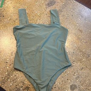 One piece Bathing suit by Reformation. Worn once as body suit with undergarment.